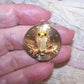 For Halloween from DANKNER, here's a 14K Yellow Gold disc charm depicting an Owl sitting on a branch.  Width/height is 1-1/8". Weight is 8.3 grams. 