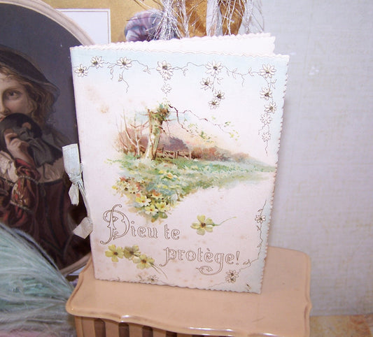 Dieu te Protege, an Antique French booklet containing a lengthy poem and color chromolightographs.  Title translates to God Protect You.  5" x 3-1/2" approx.