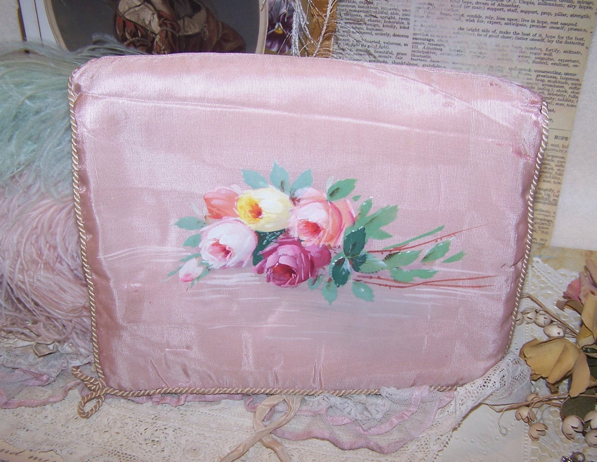 French handpainted moire hanky/lingerie holder. In a pale pink, the front design is of a bunch of roses.  Silk interior.  Needs TLC but displays beautifully.