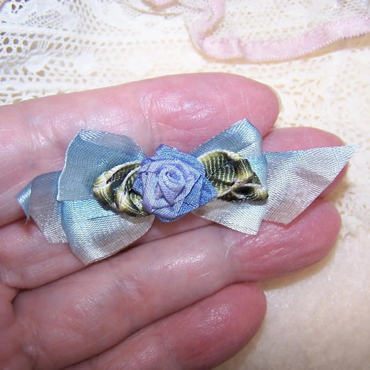 Art Deco French Revival ribbonwork rose embellishment / applique. Periwinkle blue with green ombre leaves; back ribbon bow is blue ombre satin. 2-1/2" x 1-1/8" 