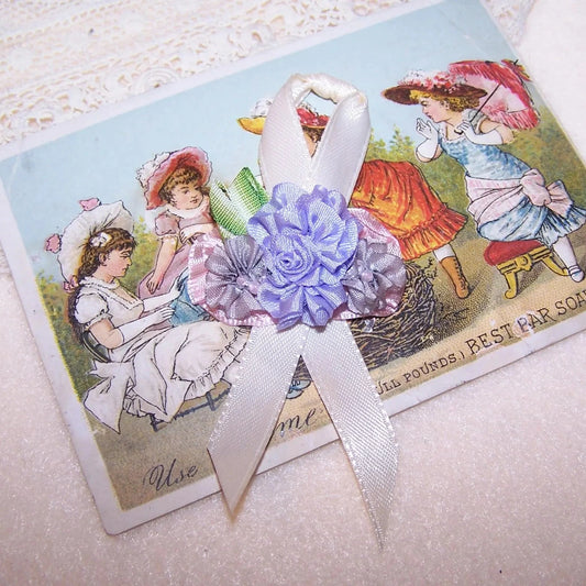 French Revival ribbonwork applique for hanky holder / lingerie bag.  Center lavender silk floral an 2 dusty mauve flowers sit on a pink rayon background.