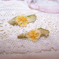 Pair French ribbon florals from an old dress. Yellow silk ombre flower with pips.  Olive green ombre ribbon leaves. 1-3/16" x 1/2" approx. Totally handsewn.