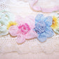Handsewn ribbon spray in a French Revival manner.  Vintage silk ribbon, rayon and French ombre ribbon make up this 4 floral spray.  3-1/8"x 1-1/4". 