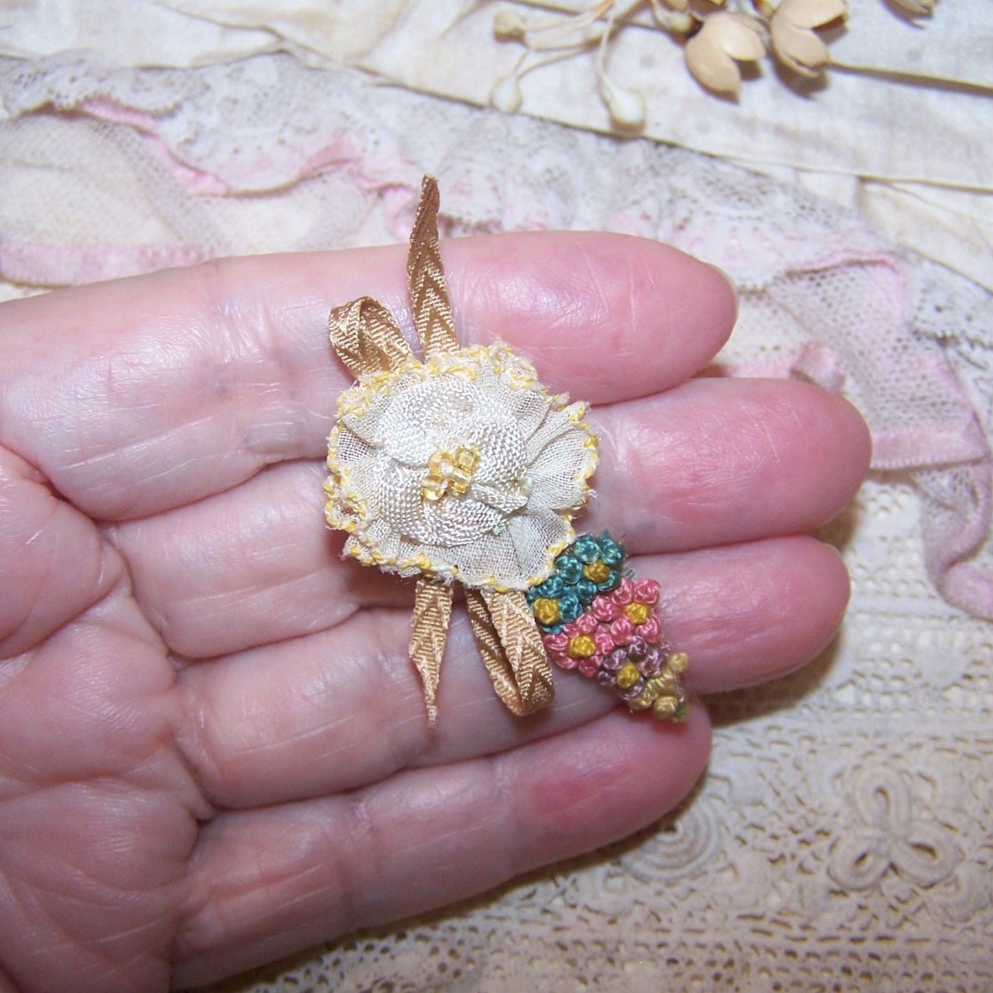Antique French ribbonwork - a yellow organza flower, seed beads at the center; floss embroidery end with Beige flourish.  1-7/8" x 1" approx. Handsewn.