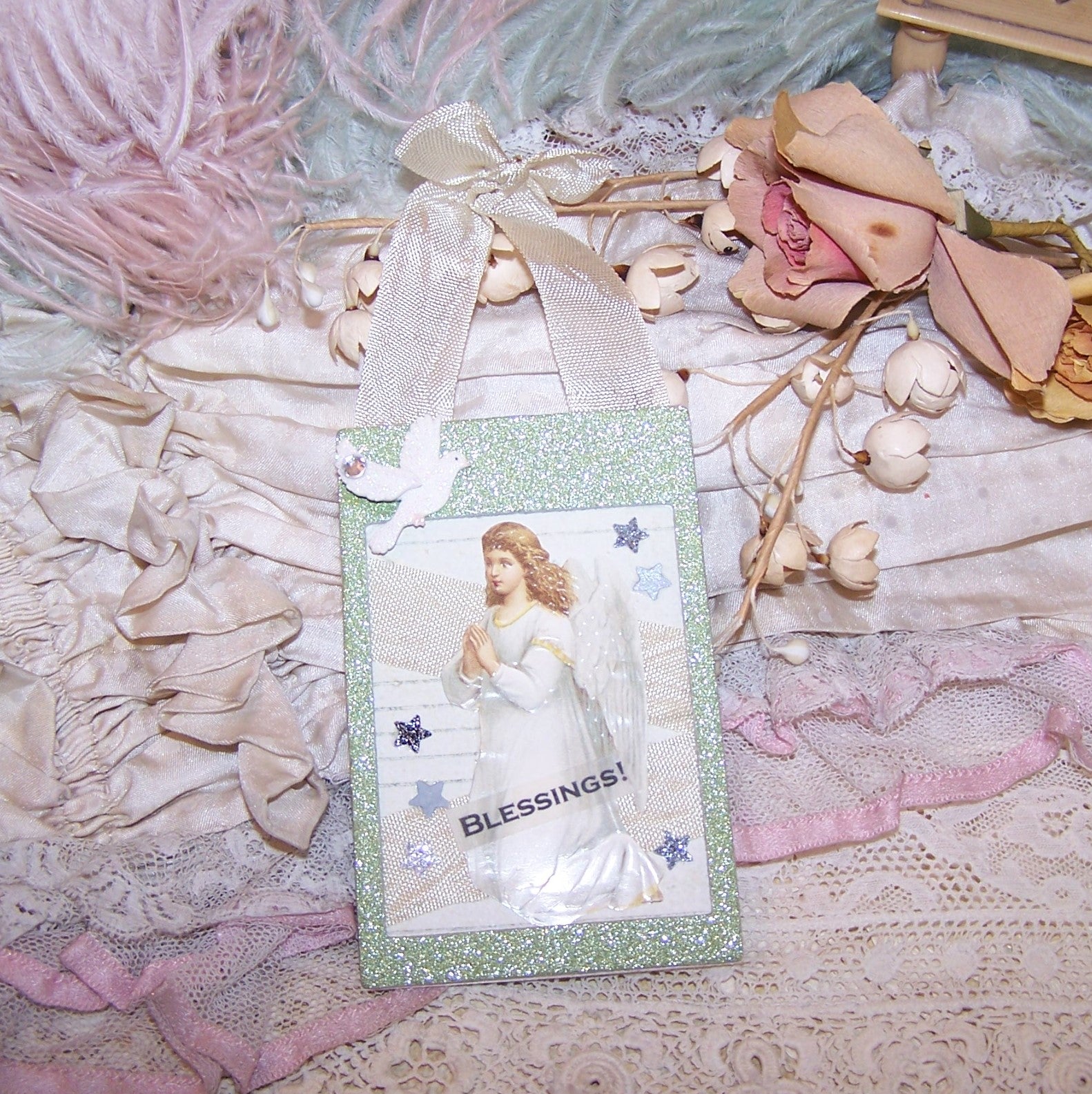 OOAK handmade ornament for any occasion. The green frame houses an Angel in a praying position. The sentiment is BLESSINGS. 