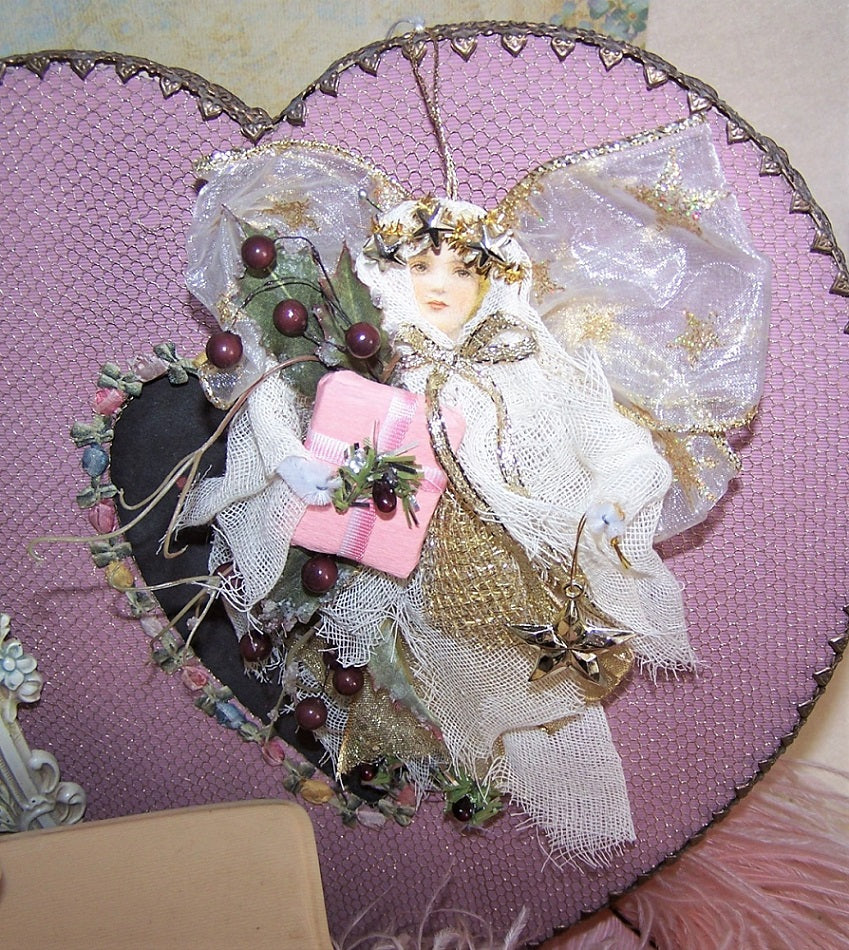 Holiday angel ornament for the home! Burgundy berry accents. Cream fabric dress.  Very lightweight.  Gold cord at back so that she can be hung. 