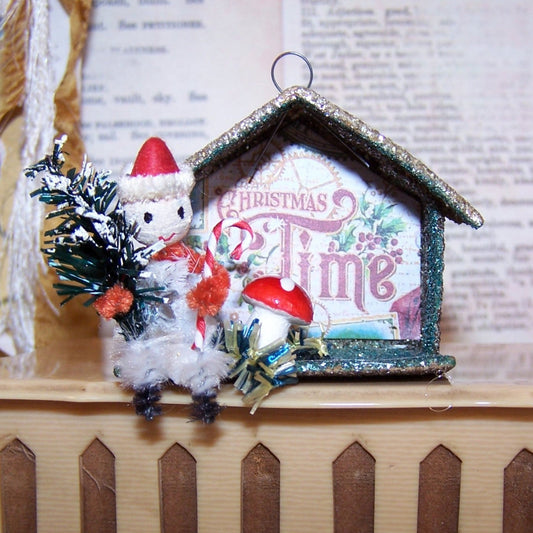 Upcycled vintage Made in Japan silver mica glitter house ornament with spun cotton head Santa pixie, bottlebrush tree and candy cane.  It's Christmas Time! 