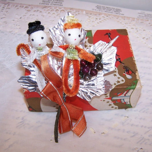 Christmas pick or package adornment Made in Japan. 2 chenille pixies, mercury glass beads, silver foil and red ribbon make up the creation.  Vintage patina. 