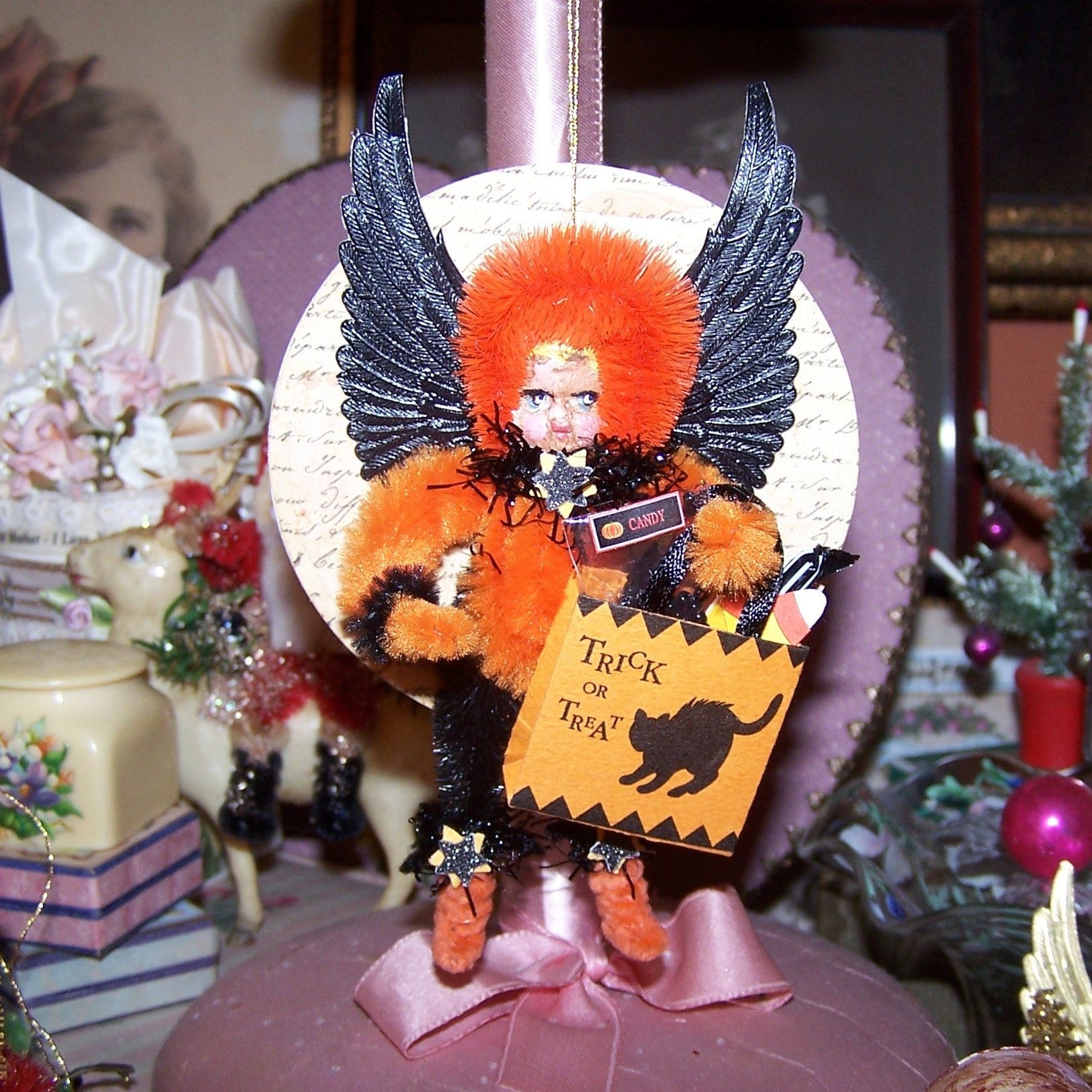 Mixed media OOAK "Dark Angel" Halloween ornament. A little girl in Black/Orange holds a Trick or Treat bag filled with candy.  A holiday accent for any area.  