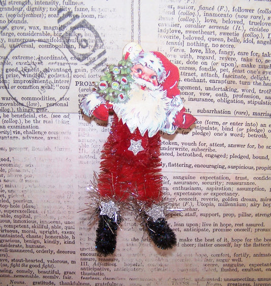 Limited Edition Santa Claus Christmas ornament. Made of chenille, Santa sports a 1950s Christmas sticker face and holds a Christmas tree. 4" x 2" approx.