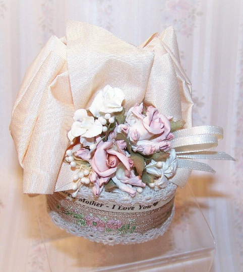 Victorian Revival oval chipwood trinket box decorated with ribbon and florals in tones of cream and mauve.  Sentiment is DEAREST MOTHER I LOVE YOU. 