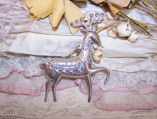 1974 Sterling Silver Christmas Pin by Oneida Silversmiths.  Depicting Cupid, one of Santa's reindeer, size is 2-3/16" x 2-7/8". 11.8 grams. Very nice condition 