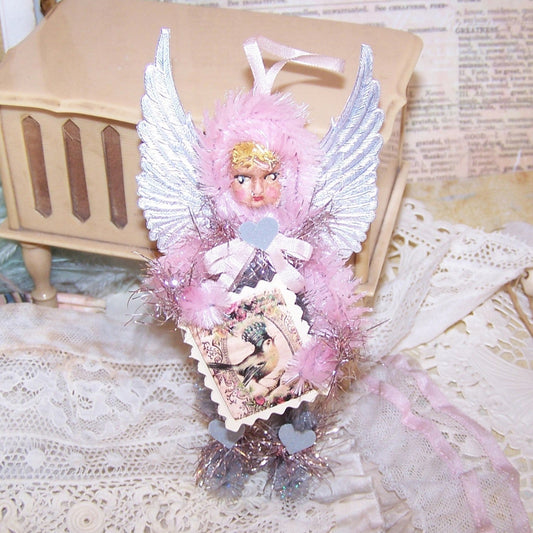 Pretty in Pink! Handmade OOAK Chenille Angel carrying a Blue Bird placard.  For Christmas or any day, the little girl has a face of handpainted clay.  