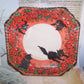 In an unopened state, but the cellophane covering has punctured and split. Set of 8 Art Deco era Halloween 8" paper plates by Perkins.  Black cats & Pumpkins.