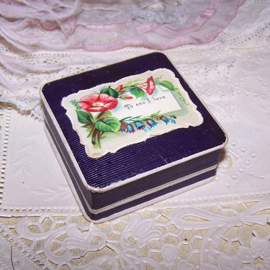 Antique paper ring box, German made for a ring.  Purple taffeta & velvet interior.  Victorian die cut on top reads TO ONE I LOVE. 2-1/4" square x 7/8" deep. 