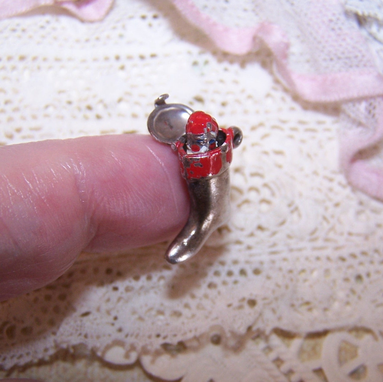 Vintage mechanical Sterling Silver and red enamel charm - Santa Claus popping out of a Christmas stocking. 11/16" high x 1/2" wide. 1.9 grams. 