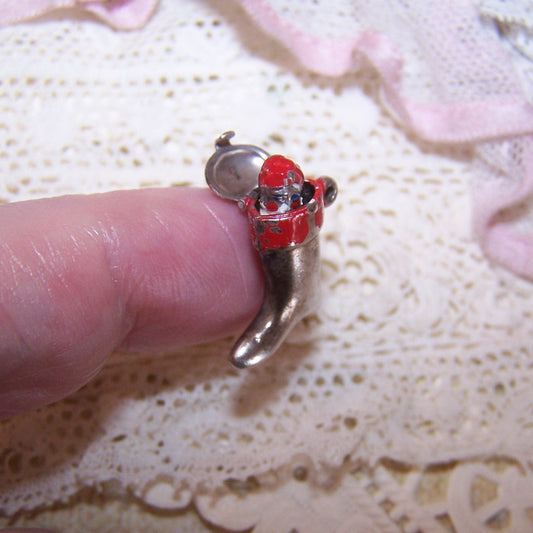 Vintage mechanical Sterling Silver and red enamel charm - Santa Claus popping out of a Christmas stocking. 11/16" high x 1/2" wide. 1.9 grams. 