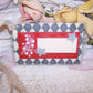 Antique Victorian Revival mixed media re-useable gift tag - package tie. Cardstock is overlaid with a calling card displaying Lily of the Valley graphics. 
