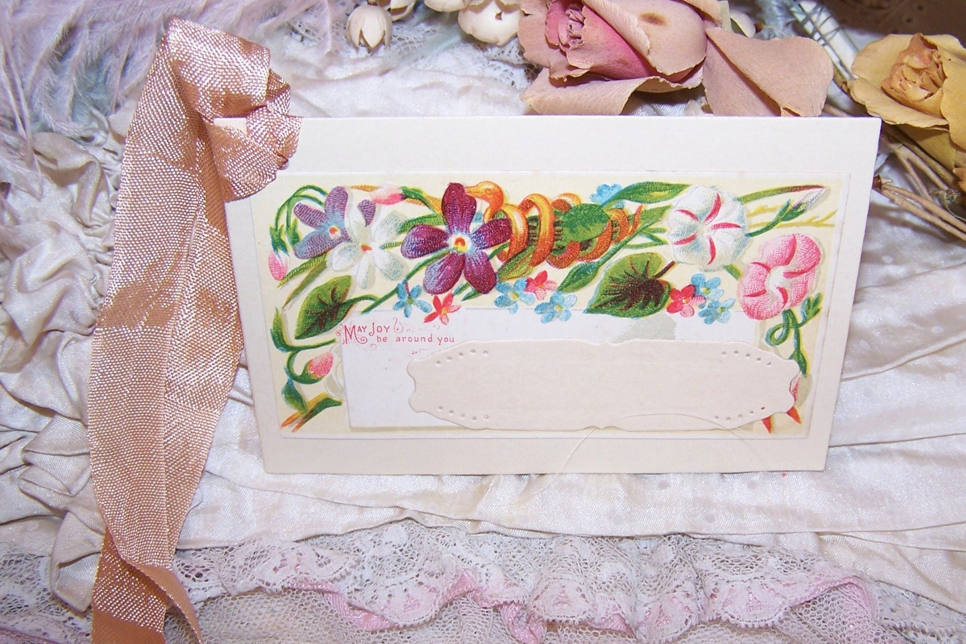 Antique Victorian mixed media gift tag/package decoration. Front of card displays florals; sentiment is MAY JOY BE AROUND YOU.  Reverse is blank. OOAK!