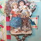 Victorian revival handmade christmas holiday ornament.  With silver tinsel wrapped around a wire armiture, the piece is embellished with made in Japan silver colored mercury glass beads.  The design of the decoration is of a young couple (children) singing a song; their dress suggests the Oliver Cromwell period in England.  height is about 4-3/4".  Very fine condition - very sturdy. 