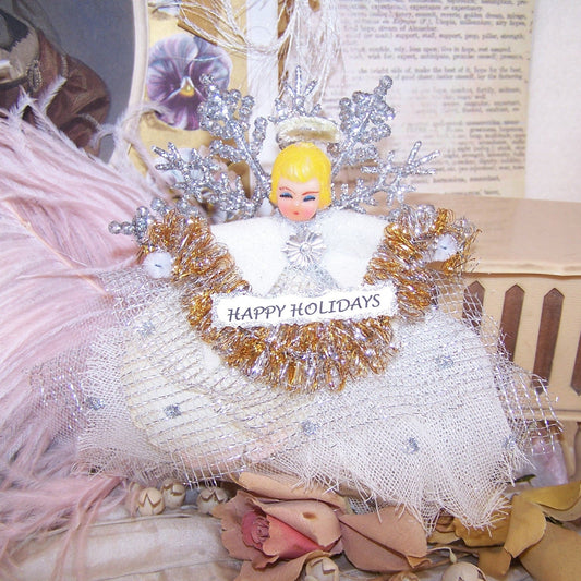 Take a vintage Made in Japan plastic angel head and add a new body.  The result? An angel ornament that can be used for any occasion. Happy Holidays!