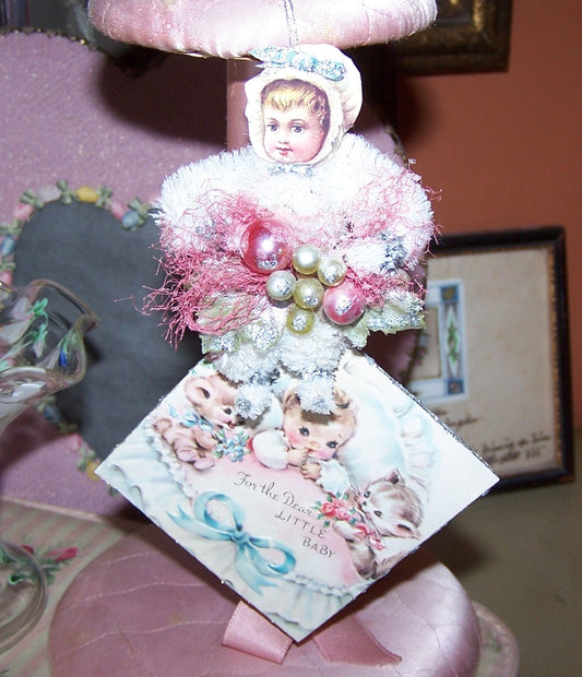 OOAK ornament for the New Arrival.  2-part piece with a chenille Bonnet Baby and 1950s Greeting Card "For the Dear Little Baby." Vintage piece.