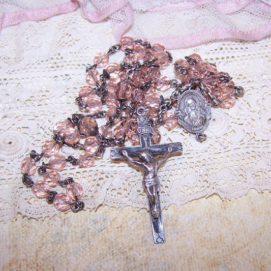 Vintage Sterling Silver and PALE pink crystal rosary.  Pater beads are 5.5mm; regular are 5mm.  Length is 20".  Cross is 1-5/8" x 15/16". 24 grams. 59 beads. 